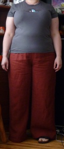 Me, wearing wide-legged orange ramie trousers and a grey t-shirt.